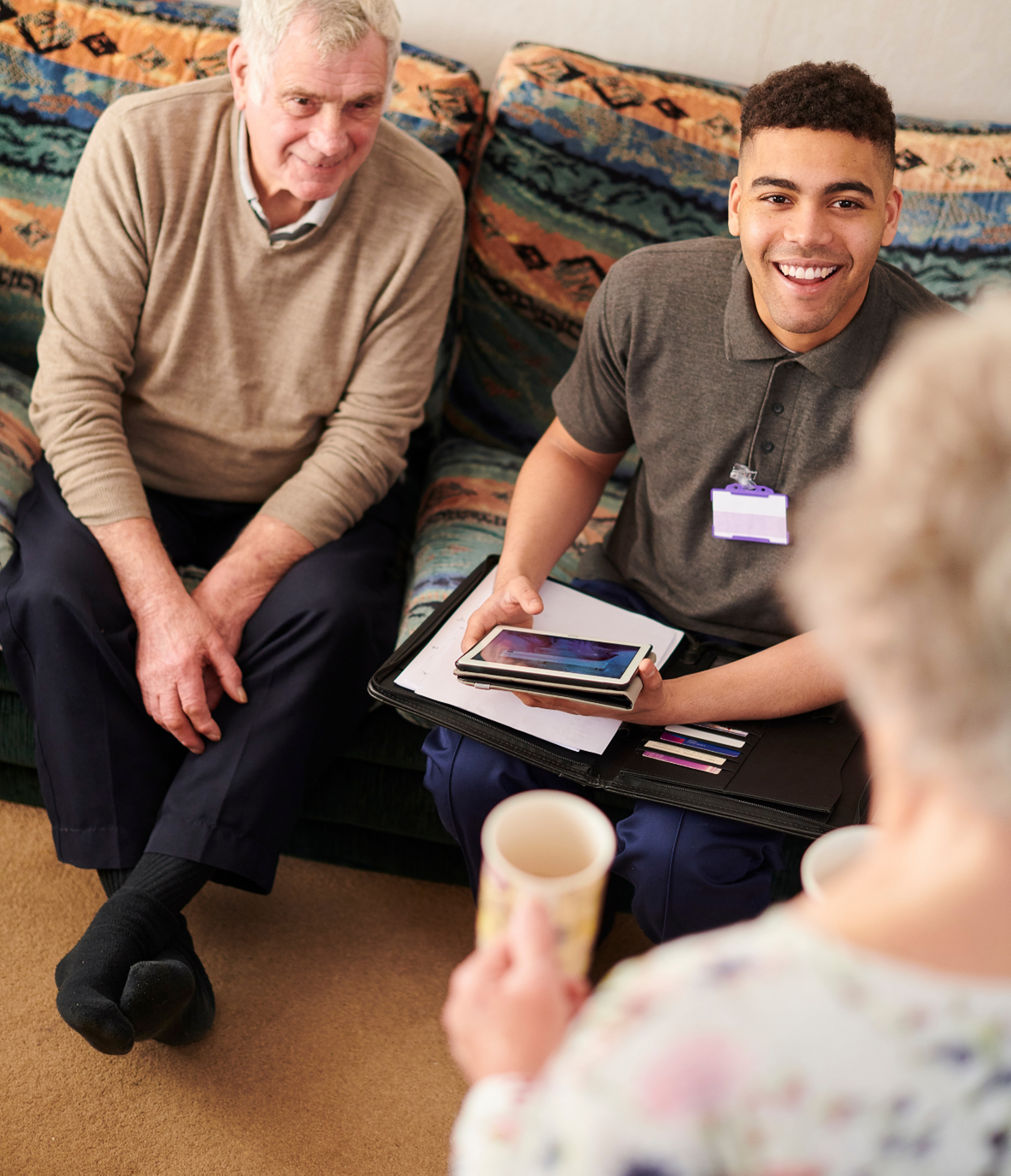 Support Coordinator speaking with two clients.